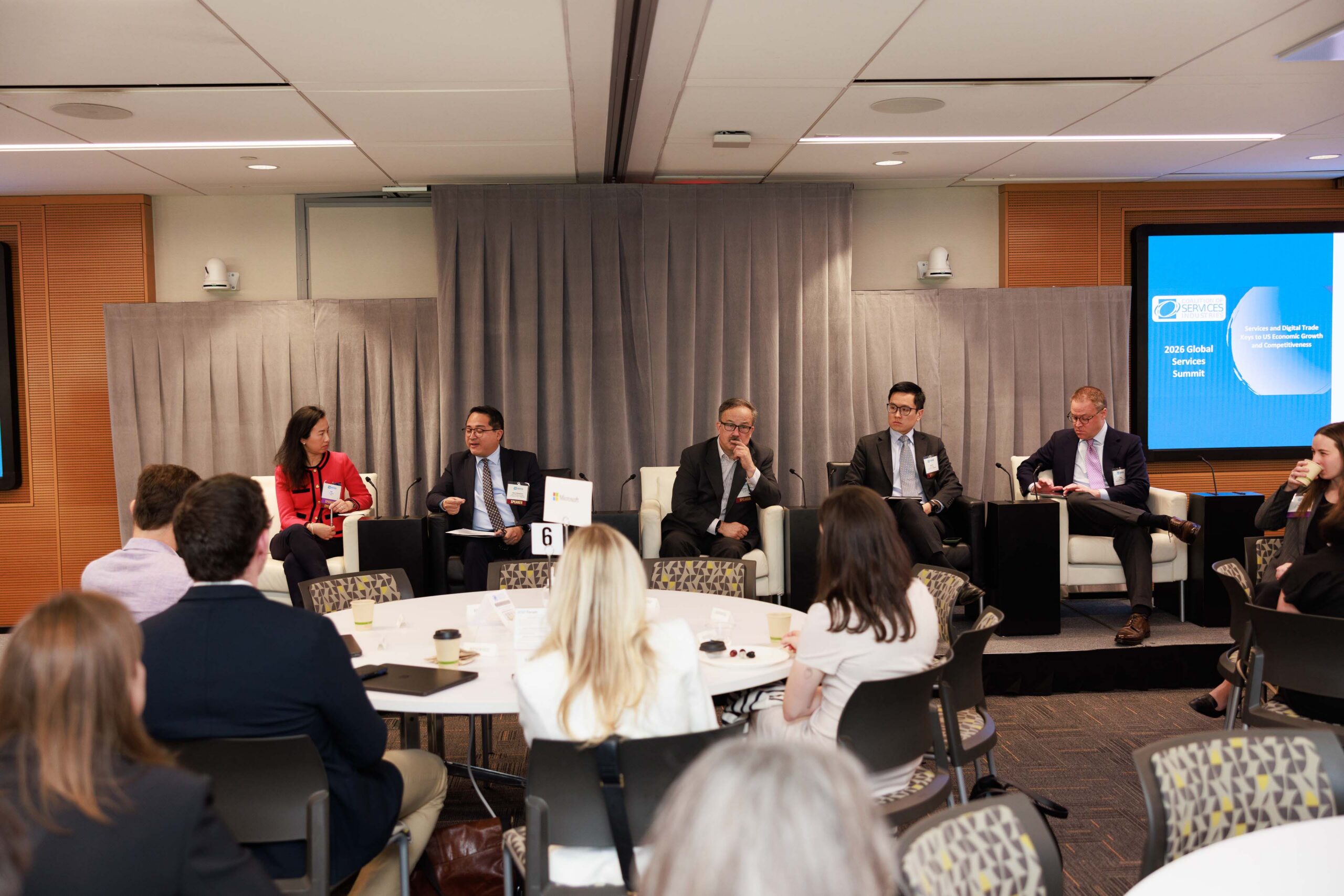 Corporate panel discussion with seated audience